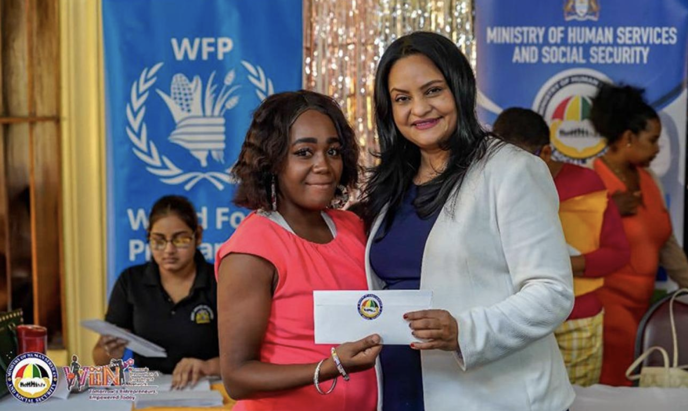 aption: Dr. Vindhya Persaud, Minister of Human Services and Social Security hands over a cash grant. | Photo: © Ministry of Human Services and Social Security
